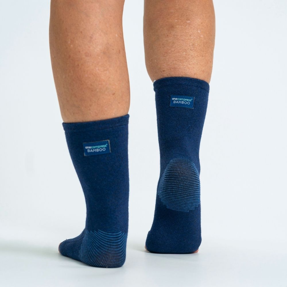 The OneCompress Bamboo Footsleeve in navy, shown from the side